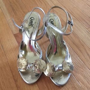 Carlos Santana gold bow heels